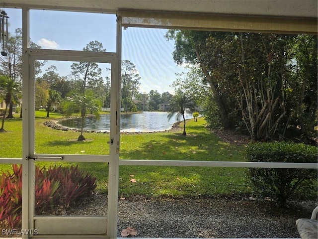 unfurnished sunroom with a water view and plenty of natural light