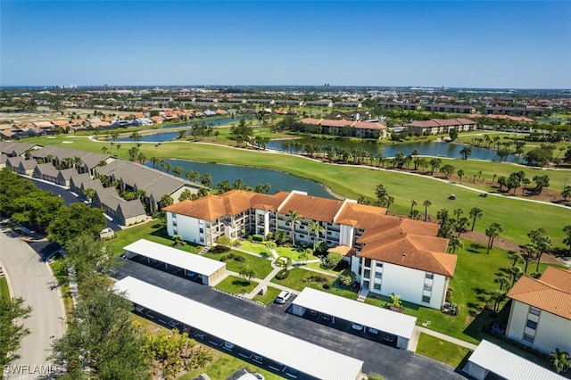 bird's eye view with a residential view, a water view, and golf course view