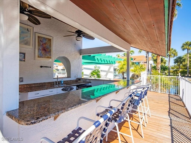 view of patio / terrace featuring a sink and ceiling fan