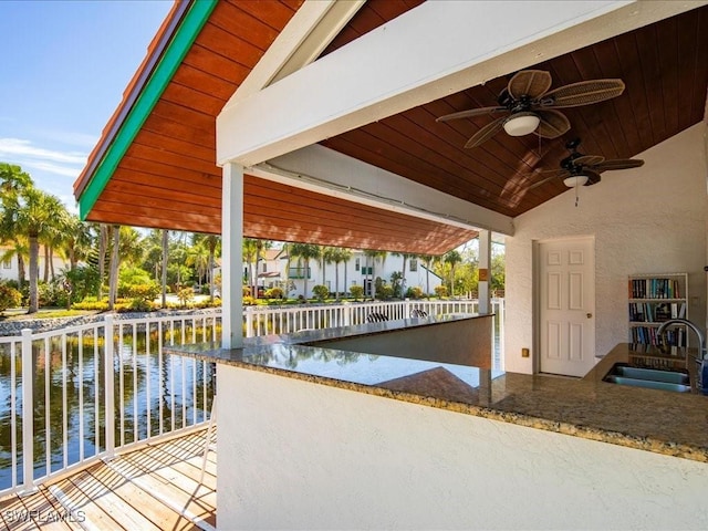 view of dock featuring a sink and a water view