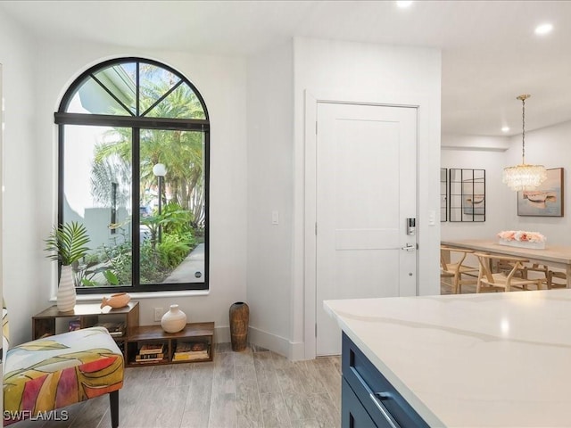 interior space with recessed lighting, light wood-style flooring, and baseboards