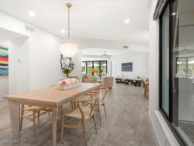 dining space with recessed lighting, visible vents, and light wood finished floors