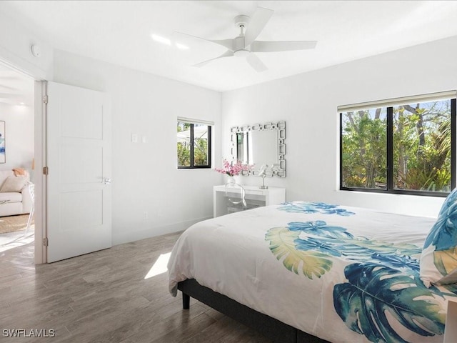 bedroom featuring wood finished floors and a ceiling fan