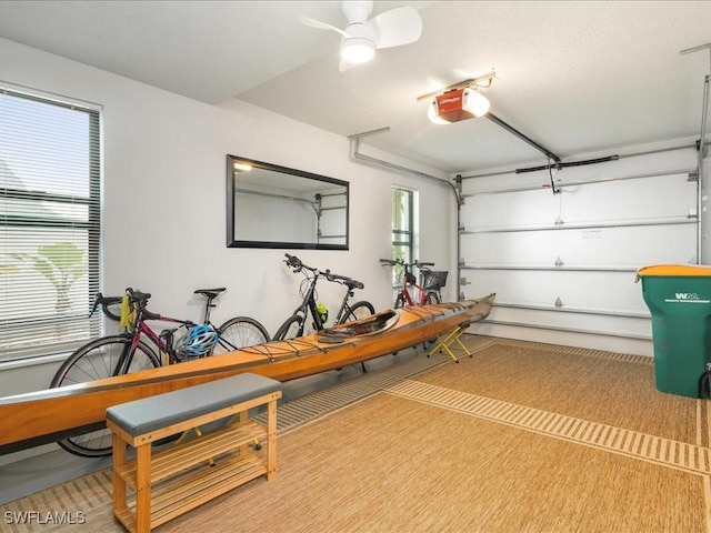 garage featuring a garage door opener and ceiling fan