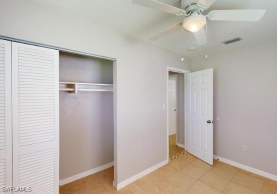 unfurnished bedroom featuring a closet, visible vents, a ceiling fan, and baseboards