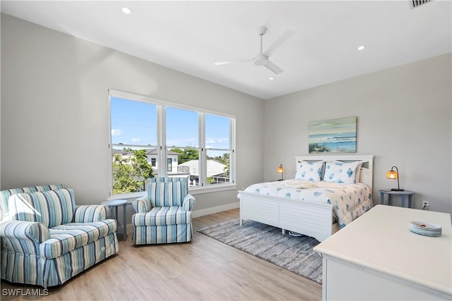 bedroom featuring light wood-type flooring, baseboards, a ceiling fan, and recessed lighting