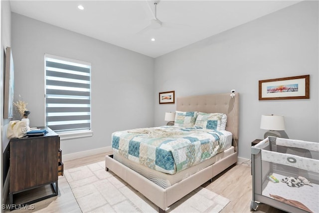 bedroom featuring recessed lighting, light wood-type flooring, and baseboards