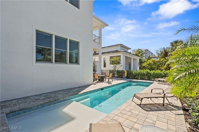 pool with a patio area