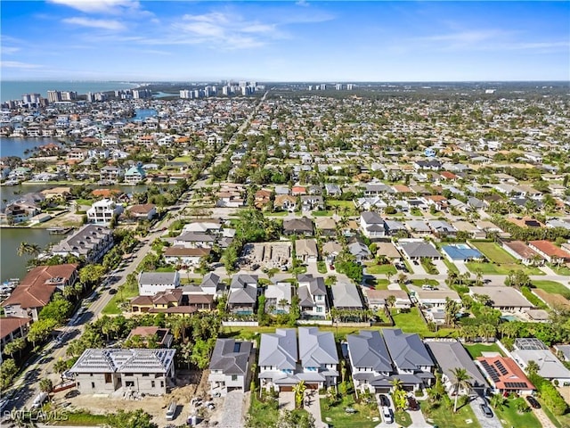 birds eye view of property featuring a water view and a residential view