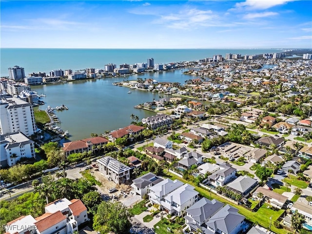 bird's eye view featuring a water view and a city view