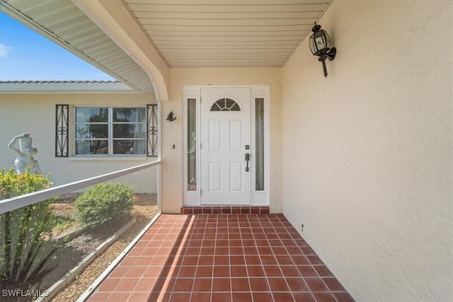 doorway to property with stucco siding