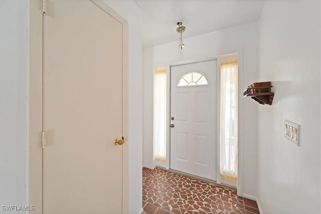 entrance foyer featuring baseboards