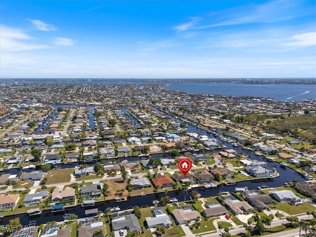 aerial view featuring a residential view and a water view