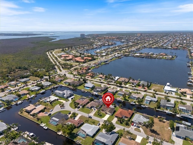 aerial view featuring a water view and a residential view