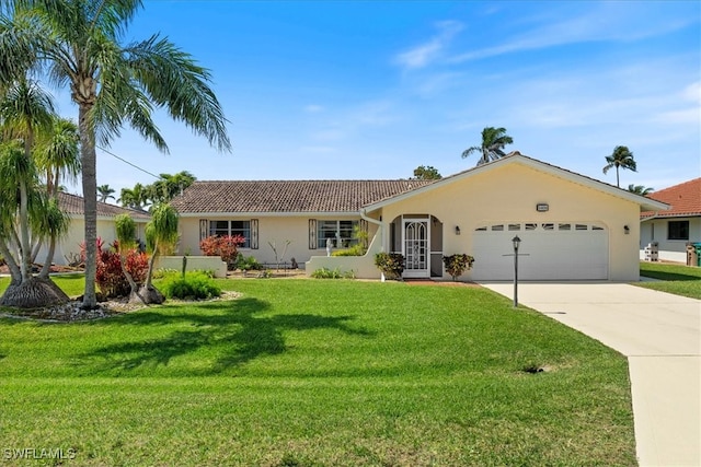 ranch-style home with a front yard, an attached garage, driveway, and stucco siding