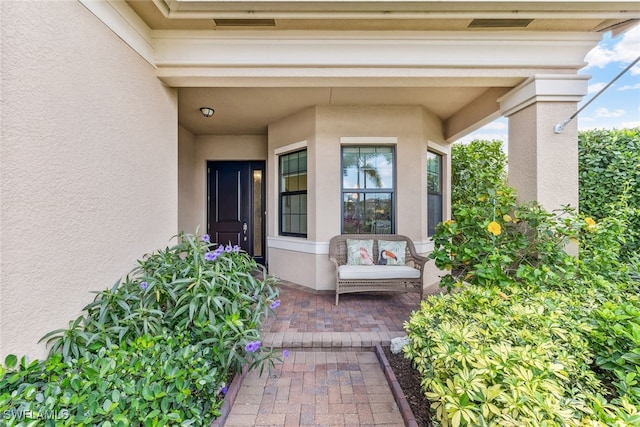 4360 Aurora St, Naples, FL 34119 - doorway to property with stucco siding