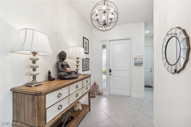 4360 Aurora St, Naples, FL 34119 - entrance foyer with a chandelier and light tile patterned flooring