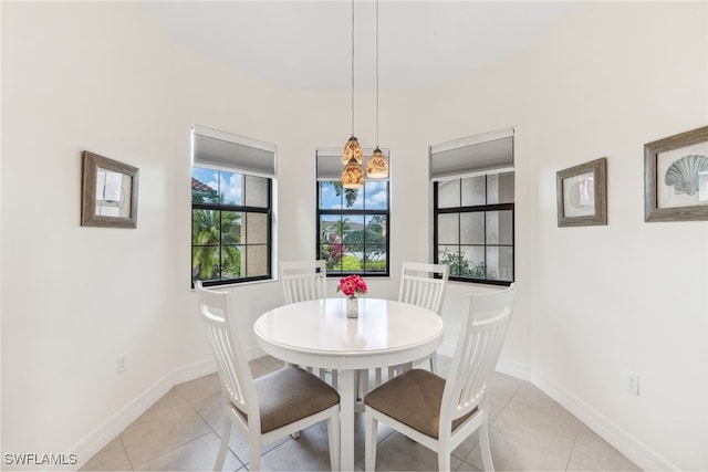4360 Aurora St, Naples, FL 34119 - dining area featuring light tile patterned flooring and baseboards
