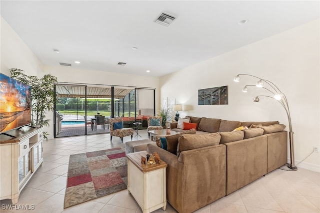 4360 Aurora St, Naples, FL 34119 - living room with light tile patterned floors and recessed lighting