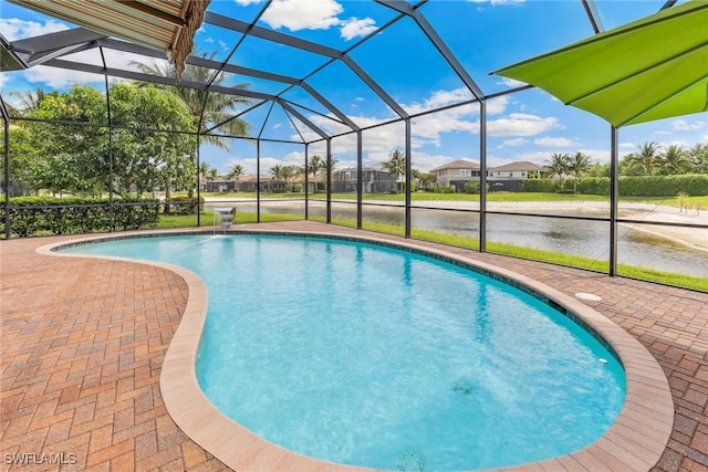 4360 Aurora St, Naples, FL 34119 - swimming pool with a water view, a patio area, glass enclosure, and a residential view
