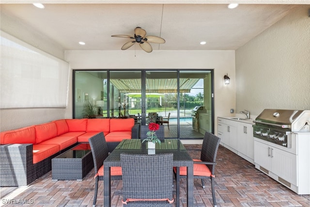 4360 Aurora St, Naples, FL 34119 - view of patio featuring a ceiling fan, an outdoor hangout area, and exterior kitchen
