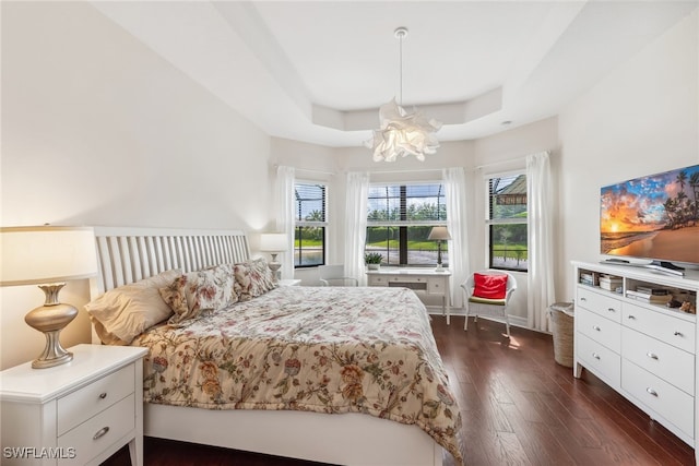 4360 Aurora St, Naples, FL 34119 - bedroom featuring dark wood-style flooring, a chandelier, and a raised ceiling