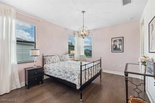 4360 Aurora St, Naples, FL 34119 - bedroom featuring a chandelier and dark wood-style flooring