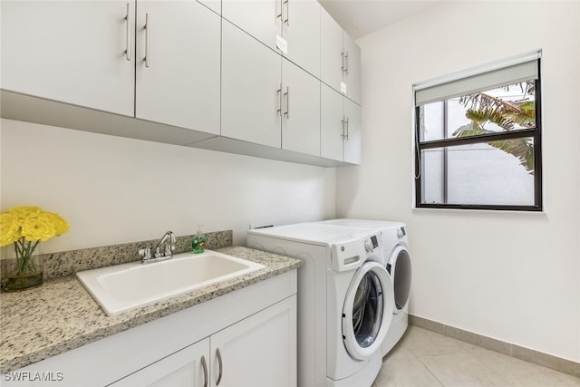 4360 Aurora St, Naples, FL 34119 - laundry room featuring cabinet space, washer and dryer, and light tile patterned floors