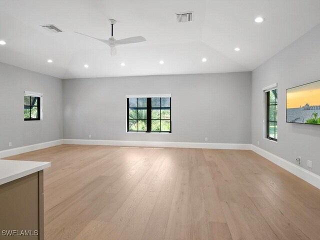 empty room featuring recessed lighting, a healthy amount of sunlight, and visible vents