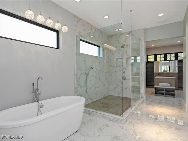 bathroom with a marble finish shower, recessed lighting, marble finish floor, and a freestanding bath