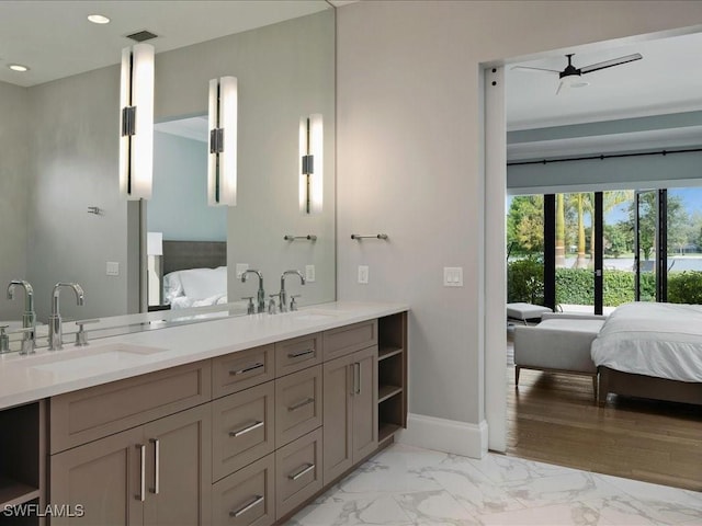 ensuite bathroom with visible vents, ensuite bath, and a sink