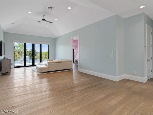 unfurnished bedroom featuring access to exterior, light wood-style flooring, baseboards, and visible vents