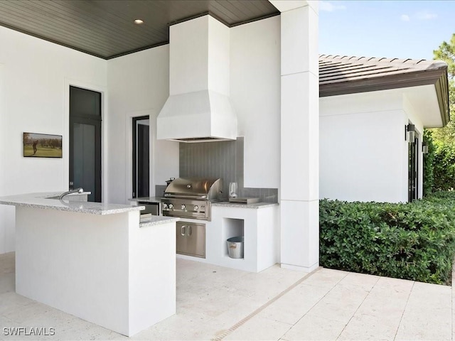 view of patio featuring grilling area and an outdoor kitchen