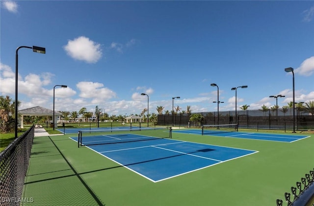 view of sport court featuring community basketball court and fence