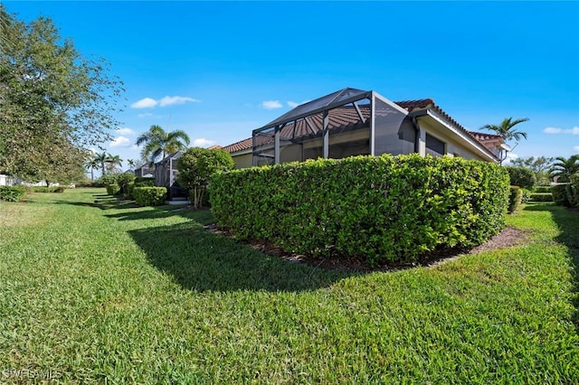 view of yard featuring a lanai