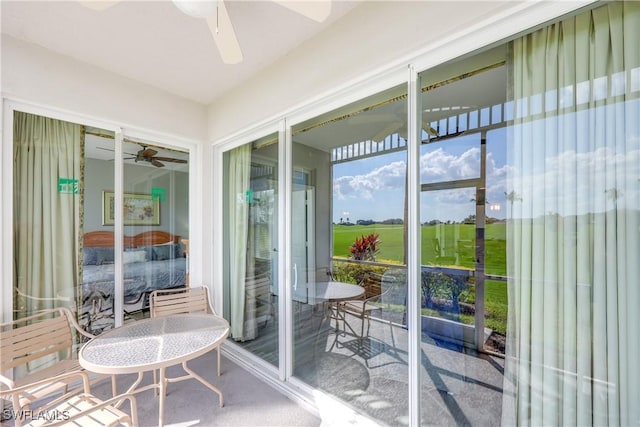 sunroom / solarium with ceiling fan