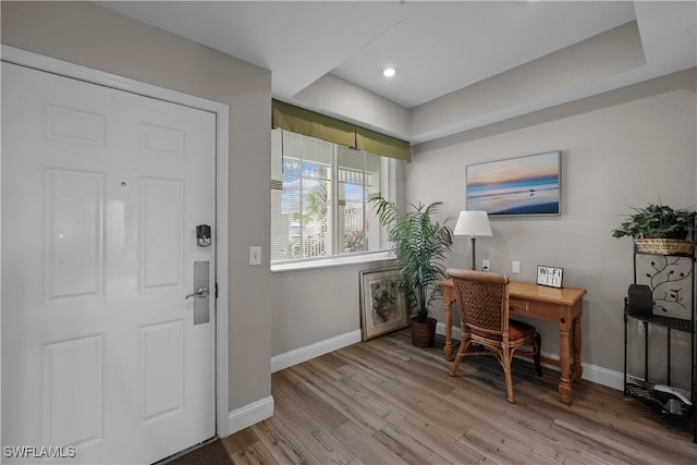 office area featuring baseboards and wood finished floors