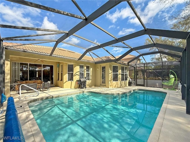 pool with a patio area, area for grilling, a lanai, and ceiling fan