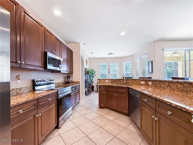 kitchen with plenty of natural light, recessed lighting, appliances with stainless steel finishes, and a sink