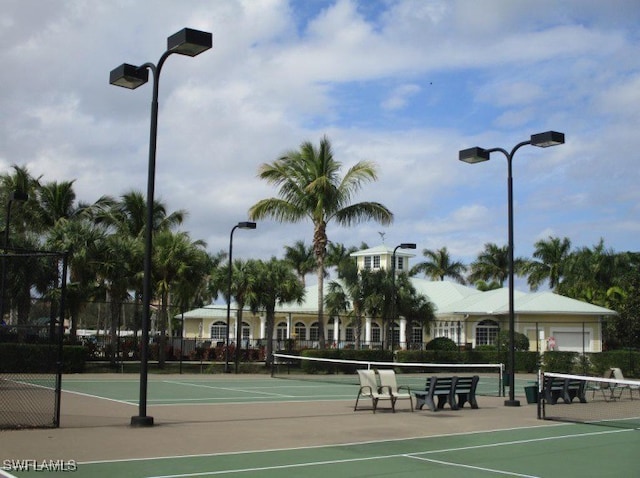 view of tennis court with fence