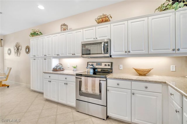 kitchen featuring white cabinetry, light countertops, and appliances with stainless steel finishes