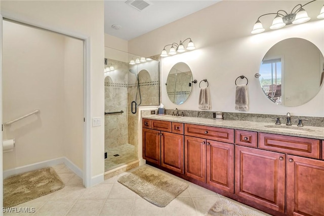 bathroom featuring a sink, visible vents, a stall shower, and double vanity