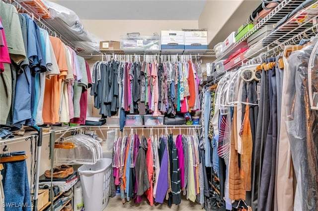 spacious closet featuring tile patterned flooring