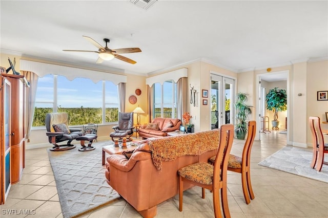 living room with crown molding, light tile patterned floors, french doors, and visible vents