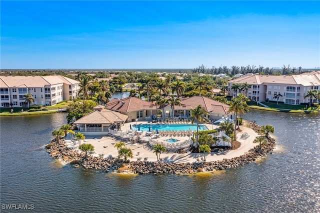 drone / aerial view featuring a water view and a residential view