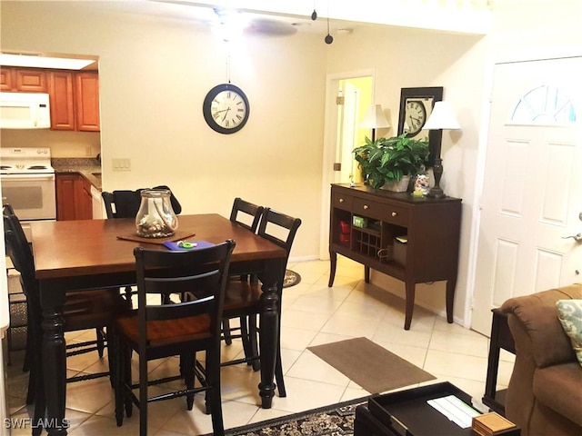 dining area with light tile patterned flooring