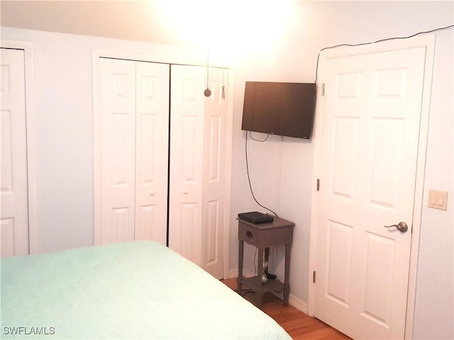 bedroom featuring light wood-style floors