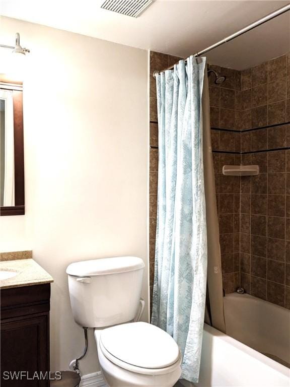 bathroom with vanity, toilet, shower / bath combo, and visible vents