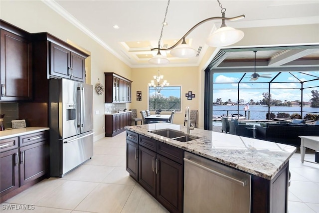 kitchen featuring a sink, crown molding, a chandelier, and stainless steel appliances