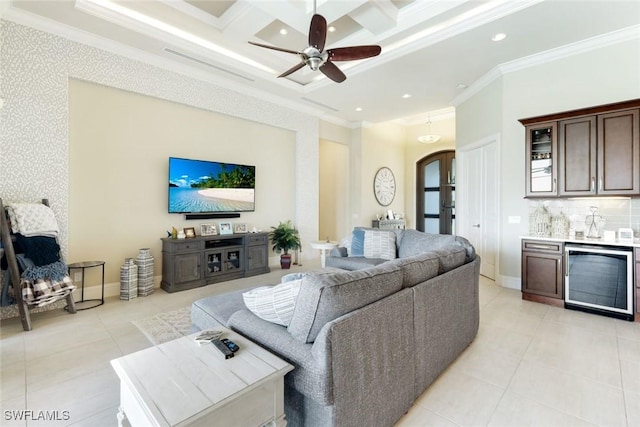 living room with a bar, crown molding, baseboards, and coffered ceiling